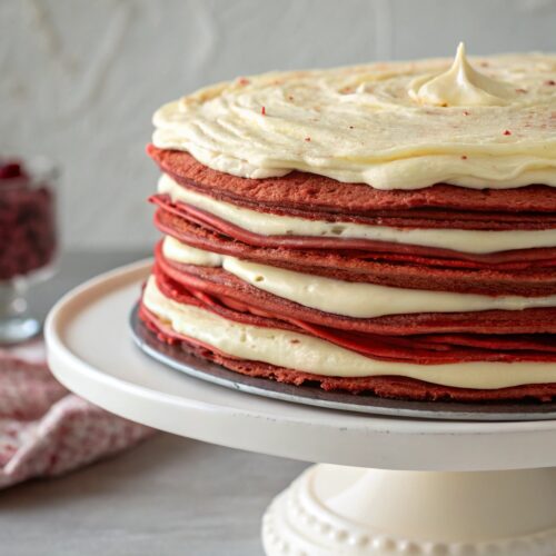Red Velvet Crepe Cake: Stunning Layers with Soulful Flavor 5 Slice of red velvet crepe cake served