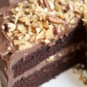 Delicious homemade German Chocolate Cake with coconut pecan frosting and chocolate layers.