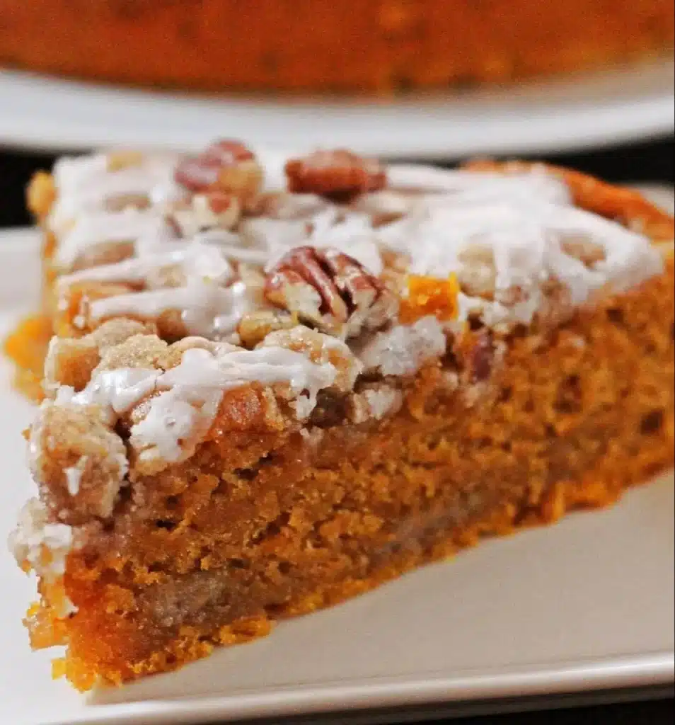 Moist cinnamon streusel pumpkin coffee cake slice on a plate