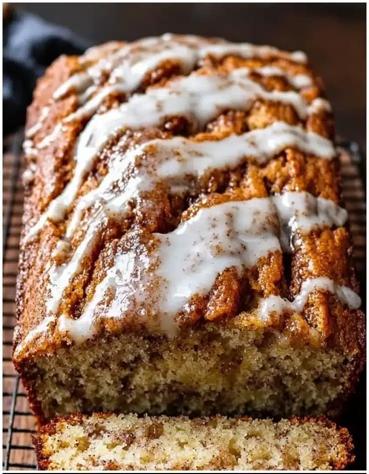 Deliciously moist Pumpkin Better Than Sex Cake topped with whipped cream and caramel sauce