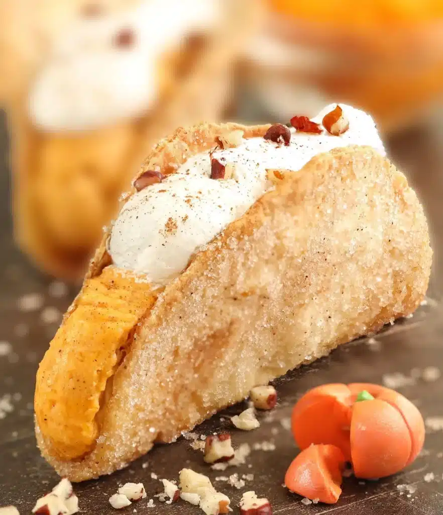 Delicious pumpkin pie tacos served with whipped cream and fall spices