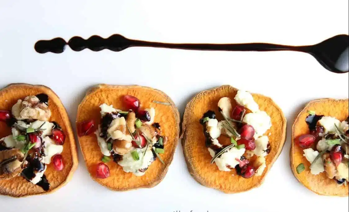 Sweet Potato Crostini with Pomegranate Herbed Gorgonzola and Balsamic Glaze 1 Sweet potato crostini with pomegranate and herbed Gorgonzola drizzled with balsamic glaze